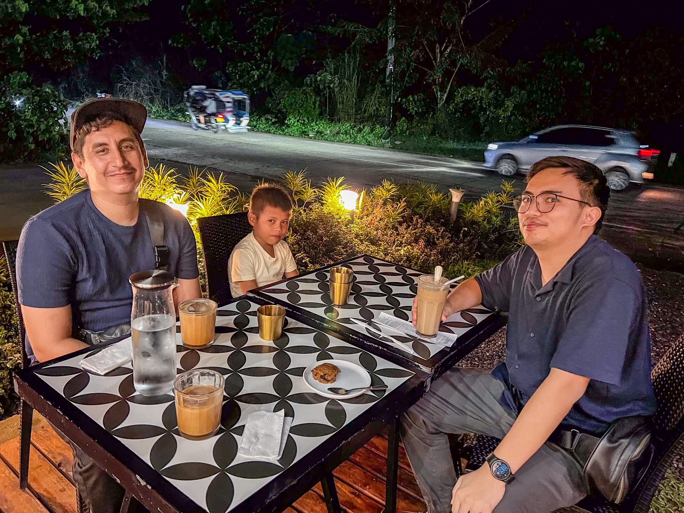 Lindy and Doc Benji drinking coffee during the brownout at White Beard Coffee in Dapa, Siargao Island